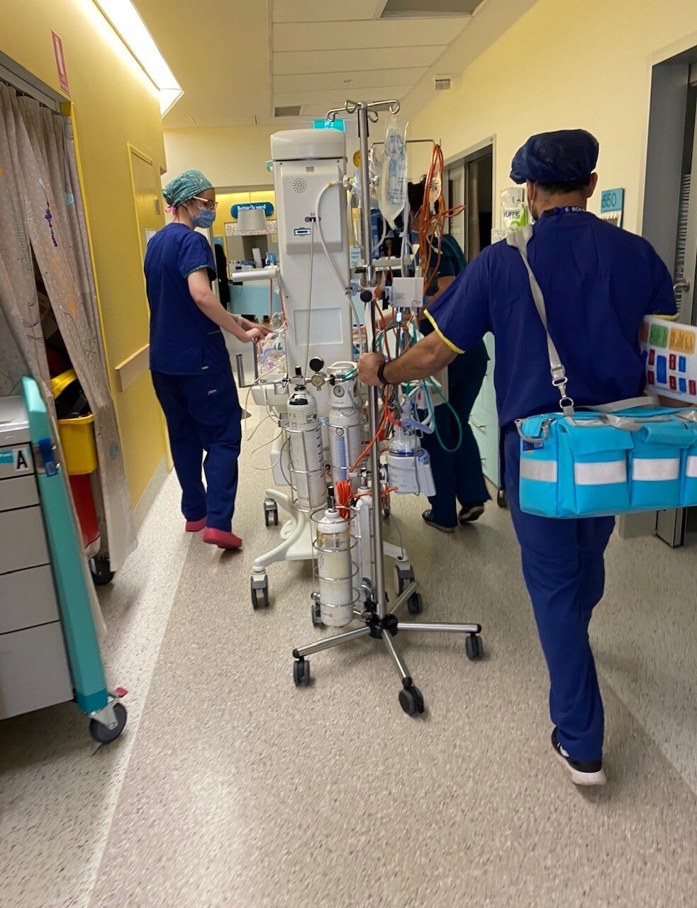 hospital staff in the hallway.