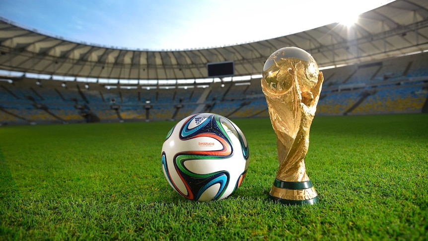 The Brazuca ball and World Cup trophy