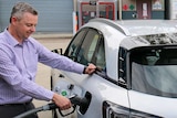 Hyundai spokesman Scott Nargar fills up a hydrogen-powered Nexo SUV at the CSIRO's technology hub