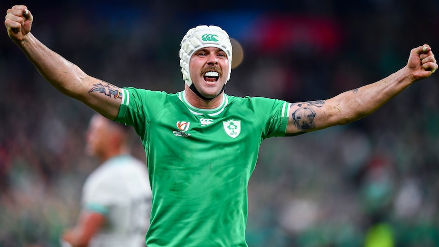 An Ireland player raises his arms in triumph after Ireland defeated South Africa at the men's Rugby World Cup.