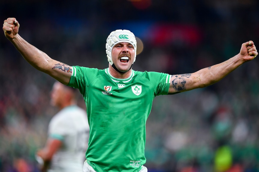 An Ireland player raises his arms in triumph after Ireland defeated South Africa at the men's Rugby World Cup.