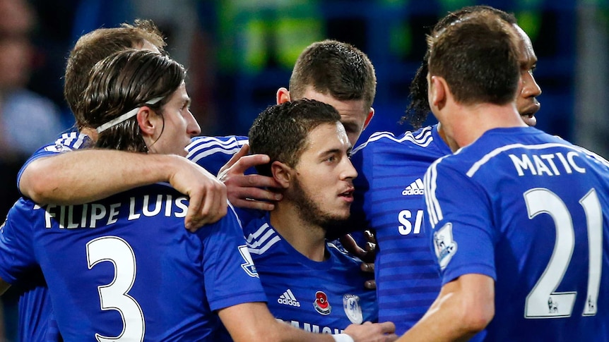 Chelsea's Eden Hazard is congratulated by team-mates