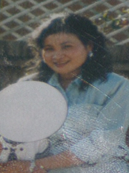 And old photo of Ranny Yun standing near a fence.