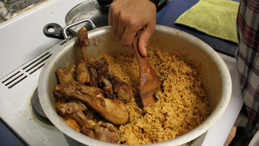A photo of a traditional dish of rice and chicken in a pot cooked by Mrs Albayati for Muharram