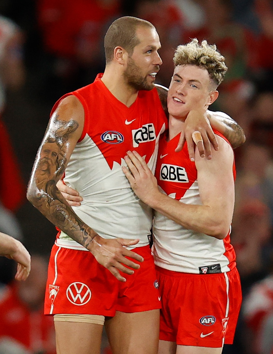 Lance Franklin puts his arm around Chad Warner