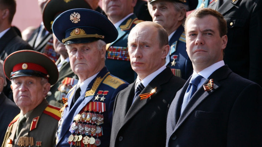 Russian President Dmitry Medvedev and Prime Minister Vladimir Putin attend a Victory Day Parade