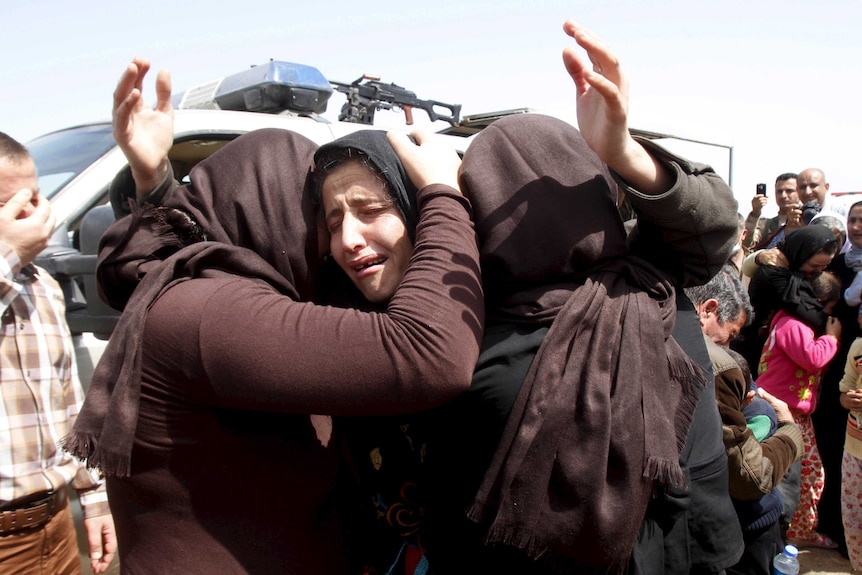 Members of the minority Yazidi sect celebrate their release