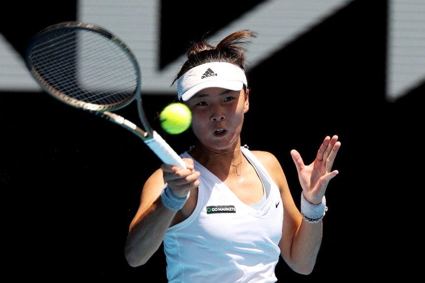 A woman playing tennis in Australian Open