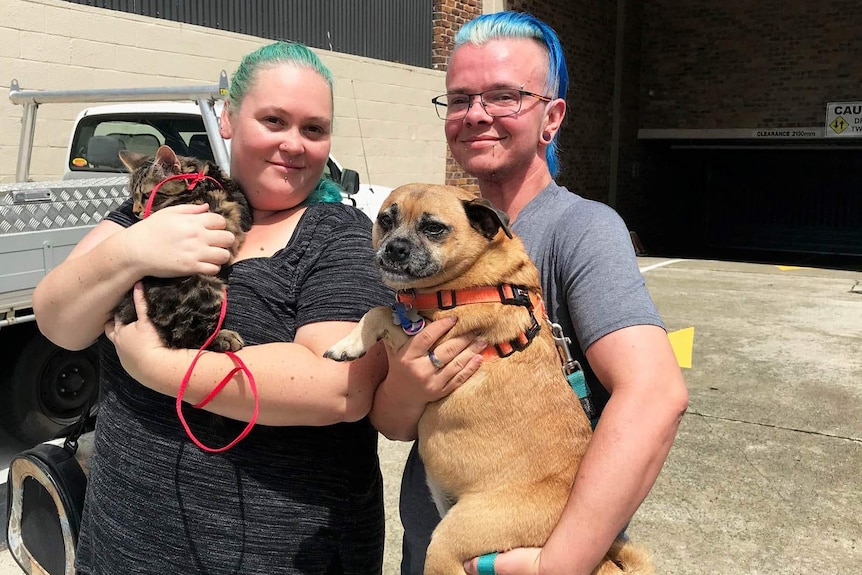 Monica with her pet Azrael (L) and Jack with Diesel at Pets