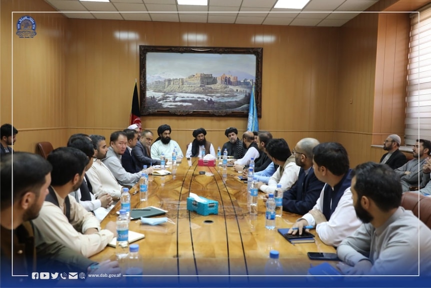 people sitting at meeting table 