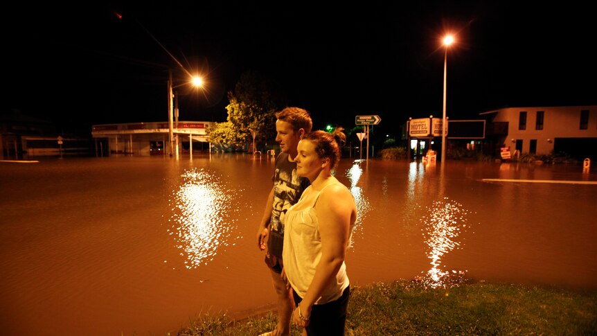 Residents take a look at the flooded streets of Gundagai on Monday, March 5, 2012.