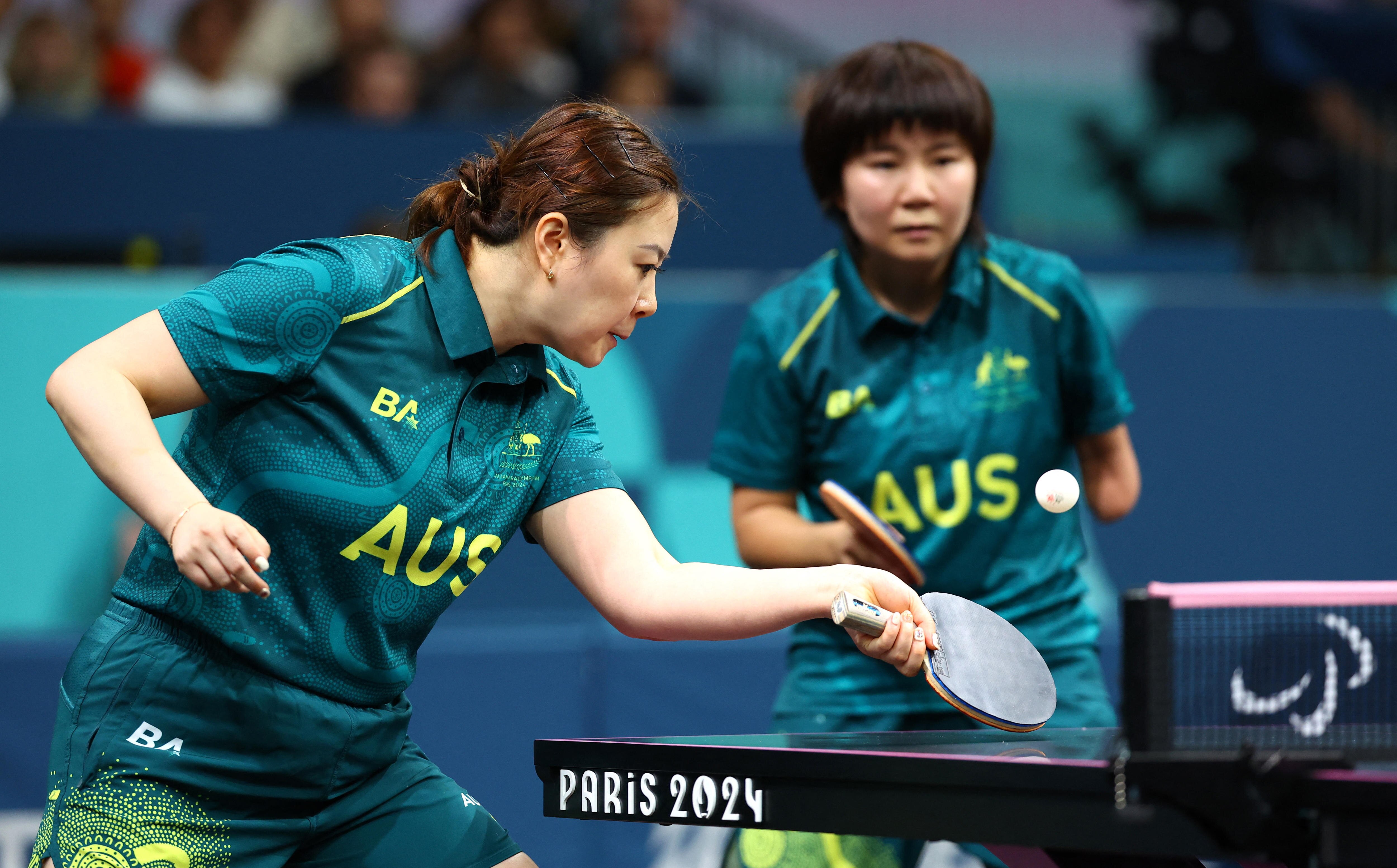 Li Na Lei and Qian Yang playing doubles para table tennis for Australia at the Paralympics