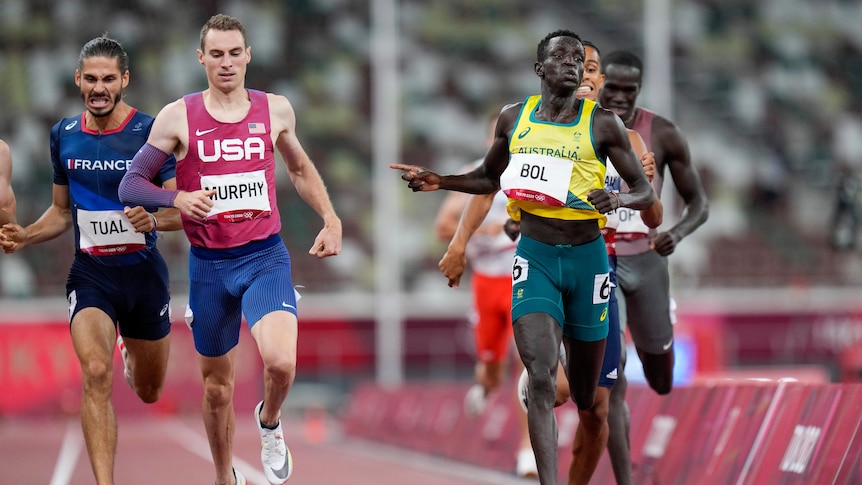 Australia's Peter Bol crosses the line ahead of French and USA runners in the 800m semi-final at the Tokyo Olympics.