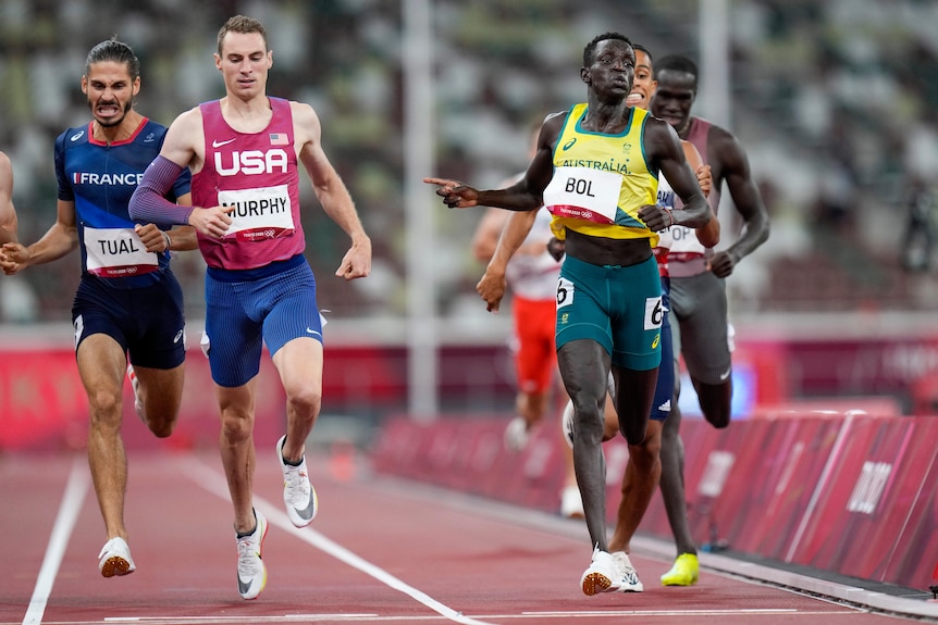 Australia's Peter Bol crosses the line ahead of French and USA runners in the 800m semi-final at the Tokyo Olympics.