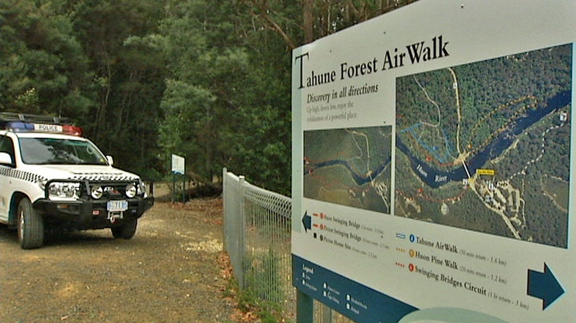 A police car, near the Tahune Airwalk sign, in southern Tasmania