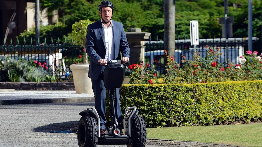 Scott Emerson rides a Segway