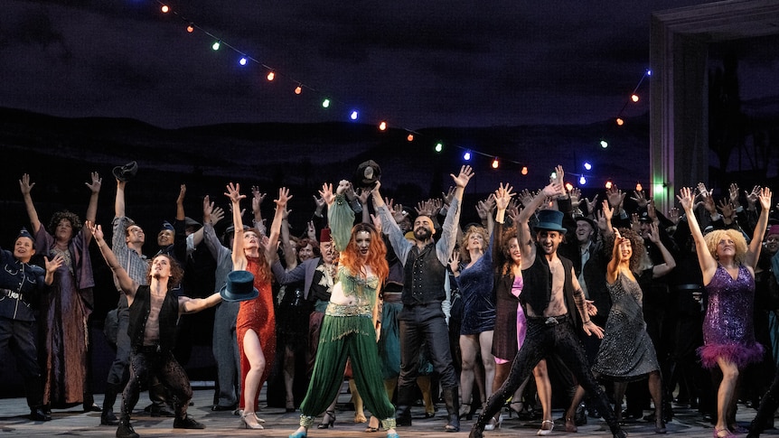A jubilant crowd scene during the 2023 production of Verdi's La forza del destino from the Royal Opera House, Covent Garden, London.