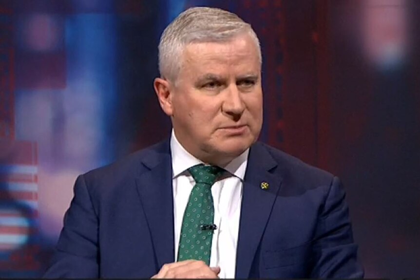 Deputy Prime Minister Michael McCormack appears on Q+A wearing a navy suit and white shirt, with tie.