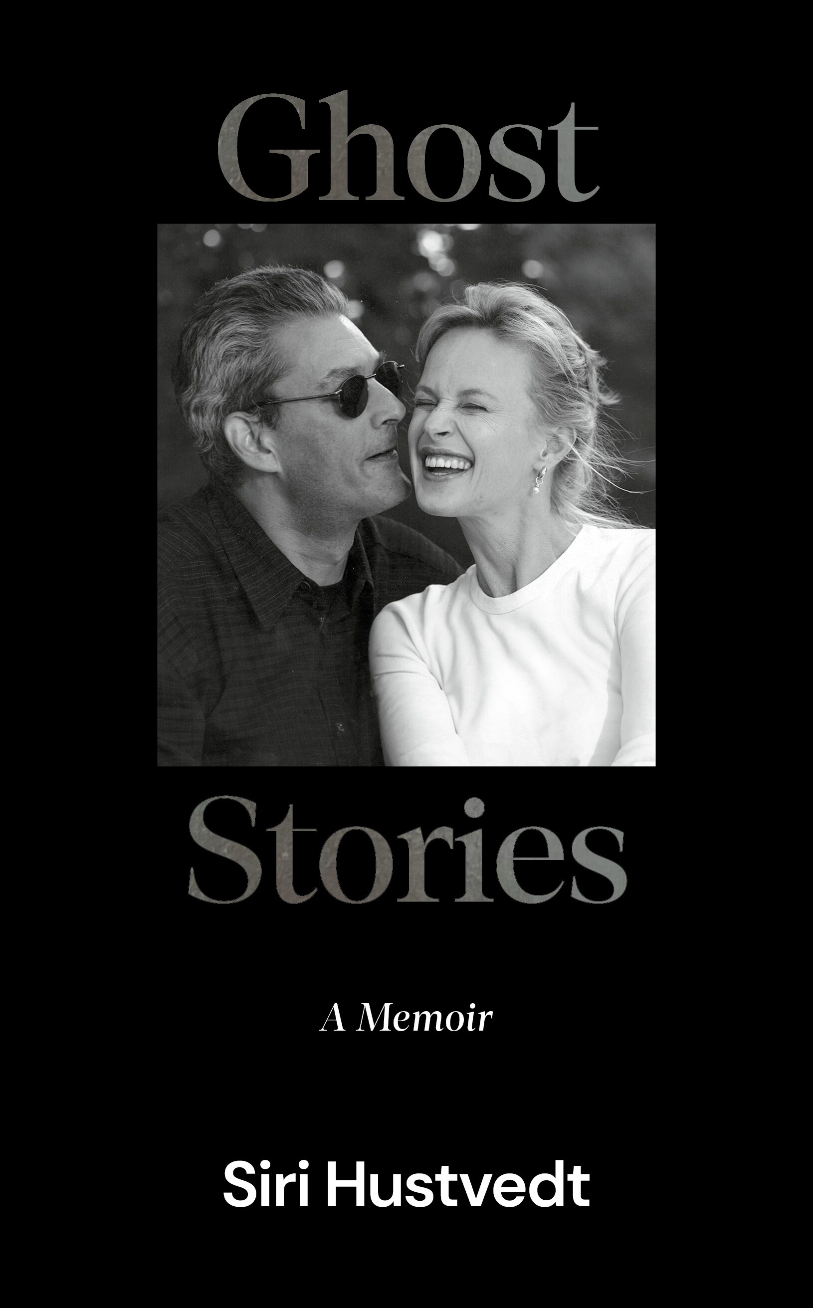 Cover of Ghost Stories by Siri Hustvedt; a black and white photo of a man and a woman looking happy together.
