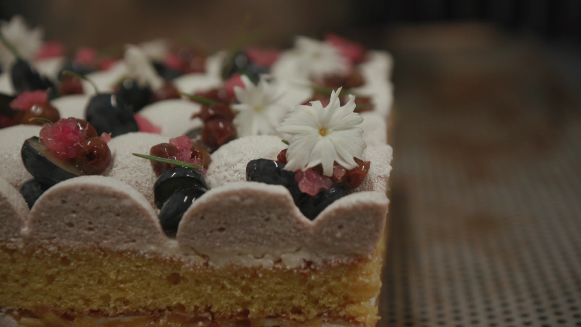 A close-up of the frosting of a cake.
