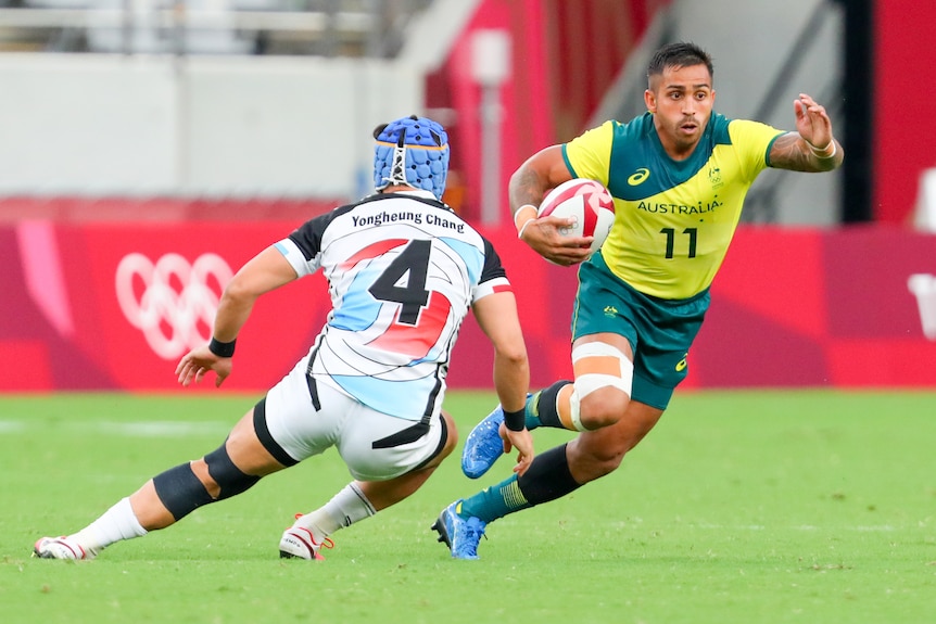 Maurice Longbottom steps past a defender with the ball under his arm