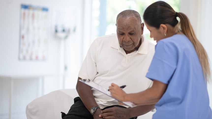 a man and a nurse complete a screening check