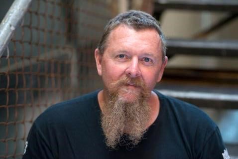 Headshot of Bradley Upton, with a beard.