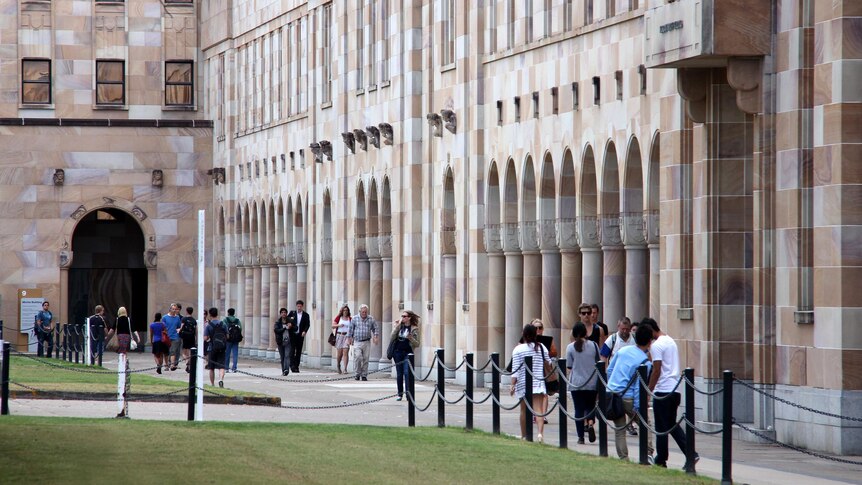 Students walk through the Great Court at the University of Queensland.