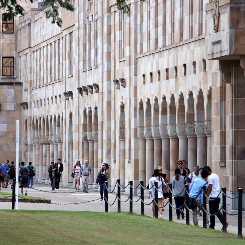 Students walk through the Great Court at the University of Queensland.