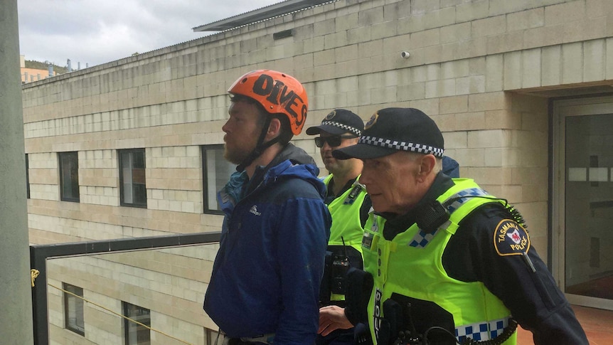 Rooftop protester Brodie Jeavons arrested by Tasmania Police
