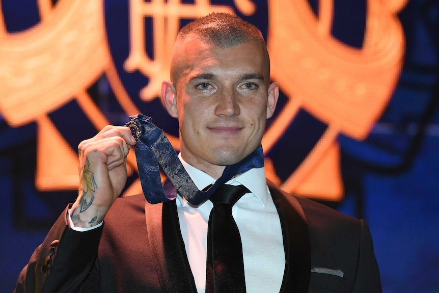 Dustin Martin poses with his 2017 Brownlow Medal.