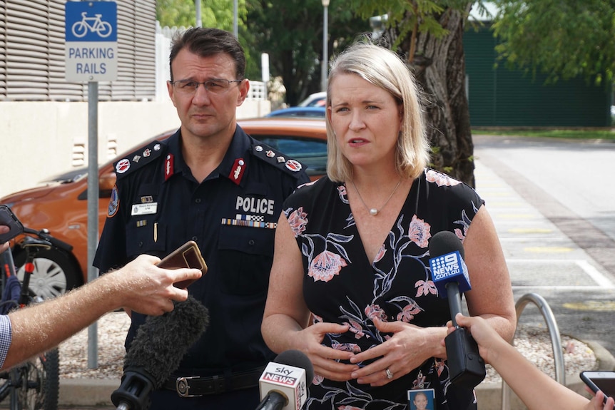 Nicole Manison and Reece Kershaw stand together at a press conference in a Darwin carpark.