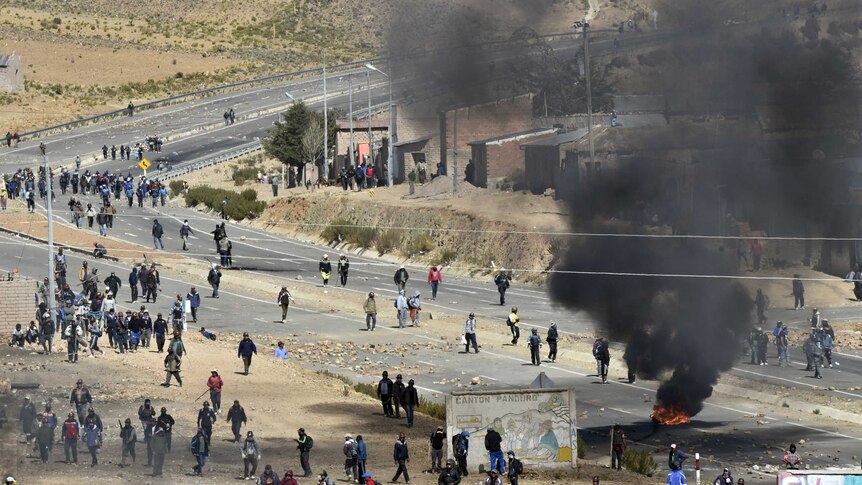 Miners clash with riot policemen in Panduro.