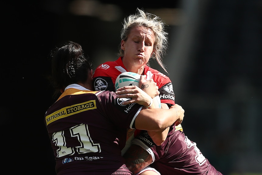 Holli Wheeler of the Dragons is tackled during the round one of the NRLW