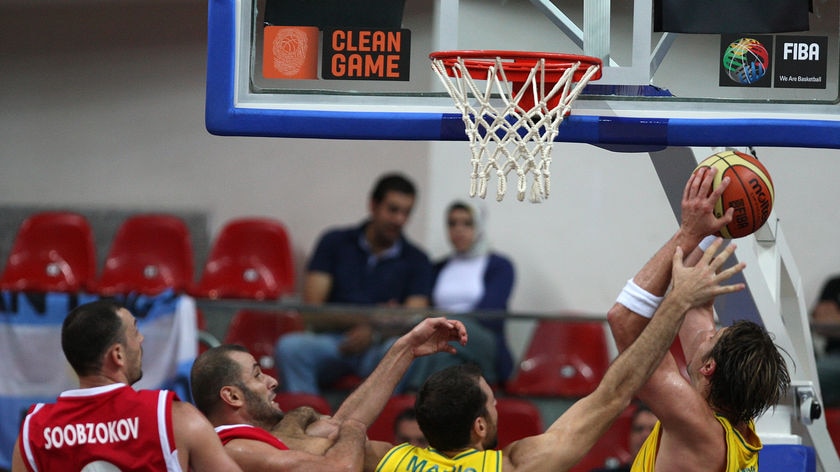 Booming start: Australia's Aleksandar Maric shields David Andersen from Jordan's defence.