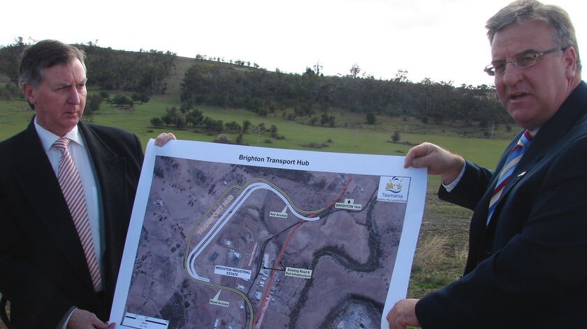 Brighton Mayor Tony Foster and Minister Graeme Sturges hold the site plan for the hub.