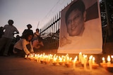 Candles lit for slain journalist