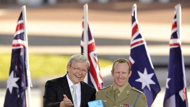 Prime Minister Kevin Rudd congratulates the Young Australian of the Year Trooper Mark Donaldson