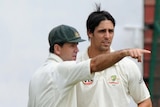 Time to go? Ricky Ponting discusses field placings with Mitchell Johnson on the final day of the second Test
