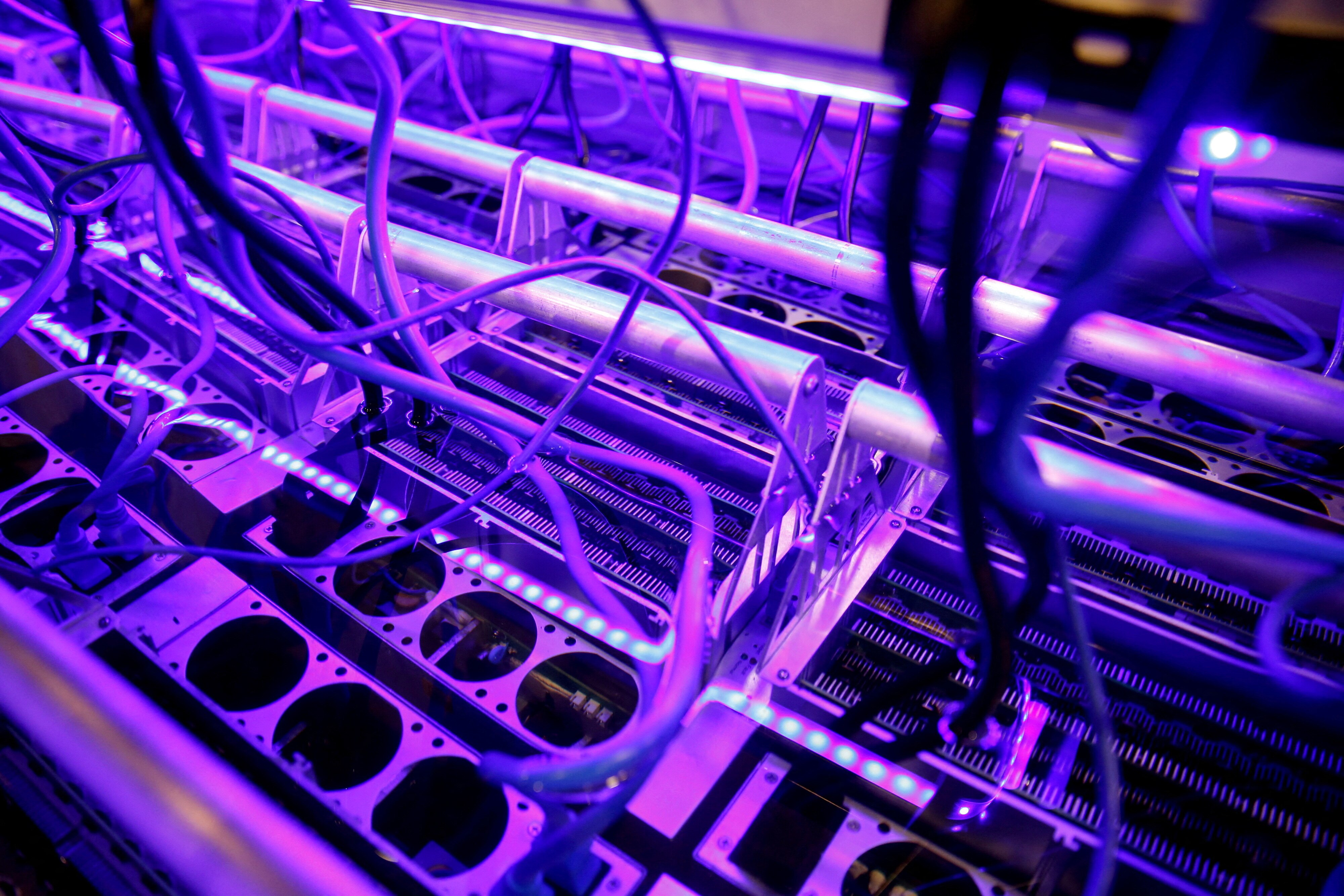 Cryptocurrency mining computers are seen in a liquid immersion cooling mining tank.