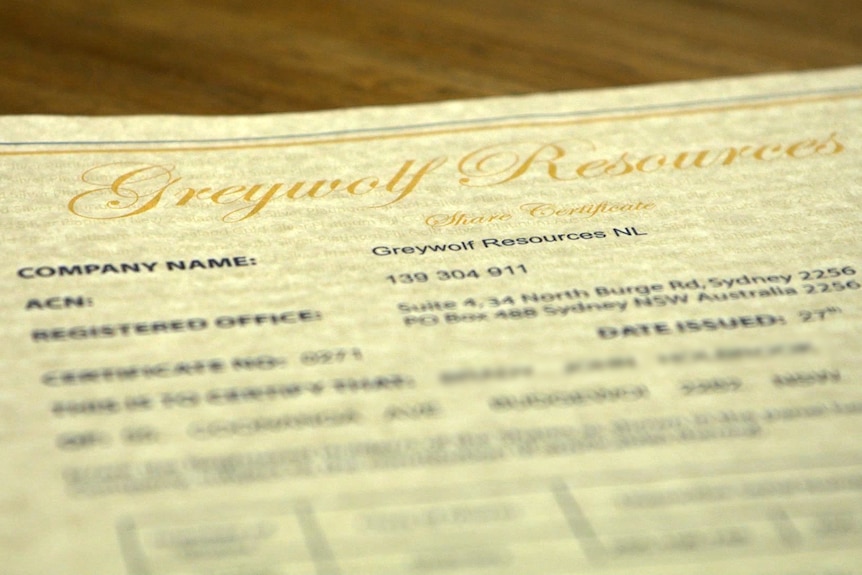 A piece of paper with the words "Greywolf Resources, Share Certificate" and details of the company, date issued, etc.