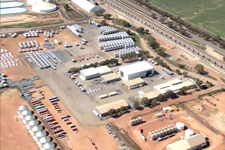 An aerial image of an industrial area which includes silos