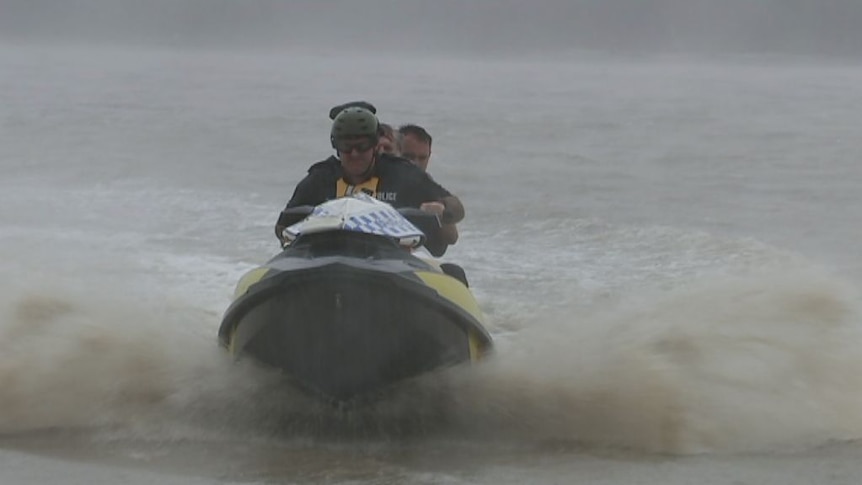 Two rescued by water police during cyclone