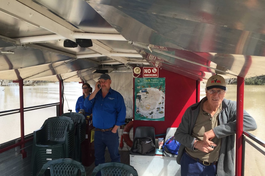 Carleen and Rob Gregory with tourist Bob Hazelwood on board their tour boat.