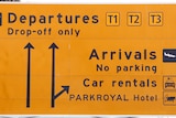 Departure/arrival signs at the entrance to Melbourne Airport