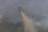 One of three aircraft battling a grassfire in Wallan, north of Melbourne