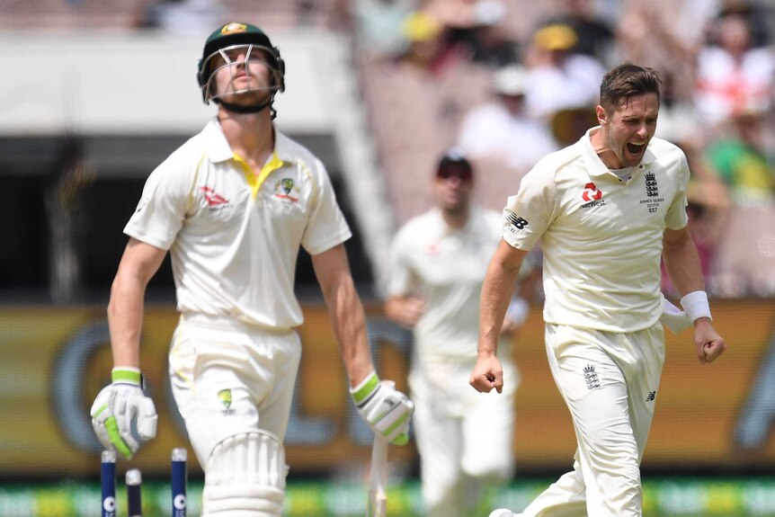 Cameron Bancroft of Australia (left) reacts after being bowled out by Chris Woakes.