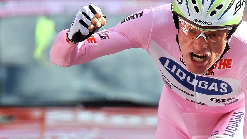 Italy's Danilo Di Luca celebrates crossing the line in stage 20 of the Giro D'Italia in 2007.