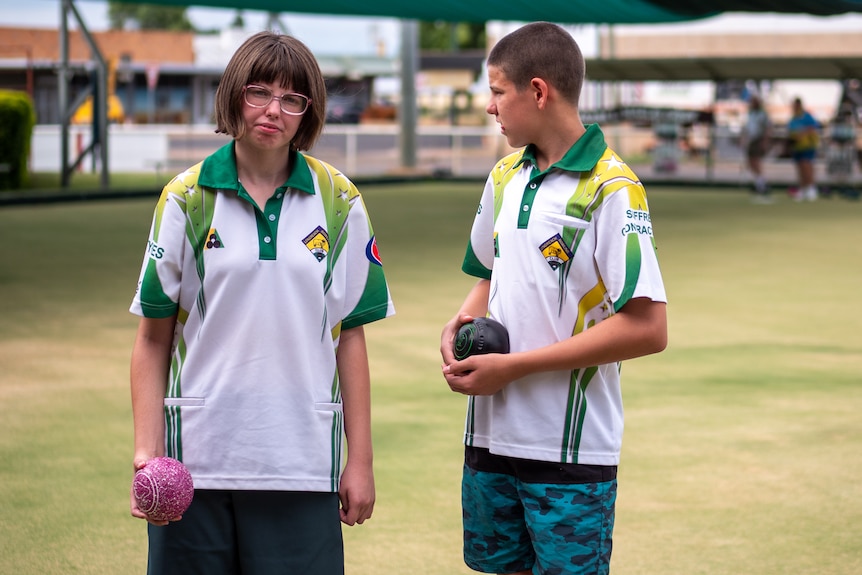 Siblings Chloe and Thomas at the Longreach bowling club, November 2023.