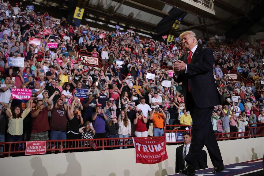 Donald Trump walks the runway at his 100 day rally in  Pennsylvania